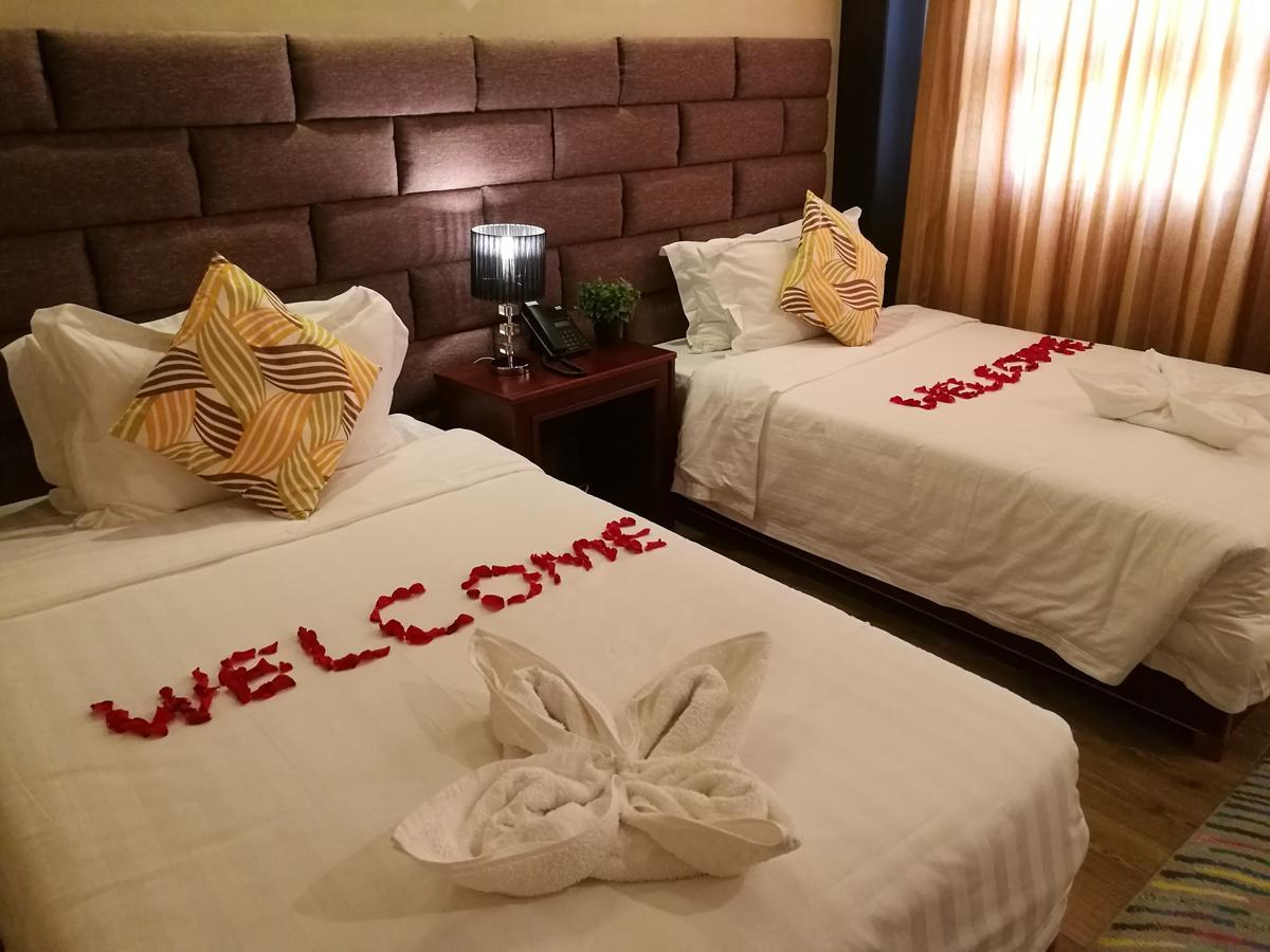 Great Wall Hotel Дар ес Саалам Стая снимка